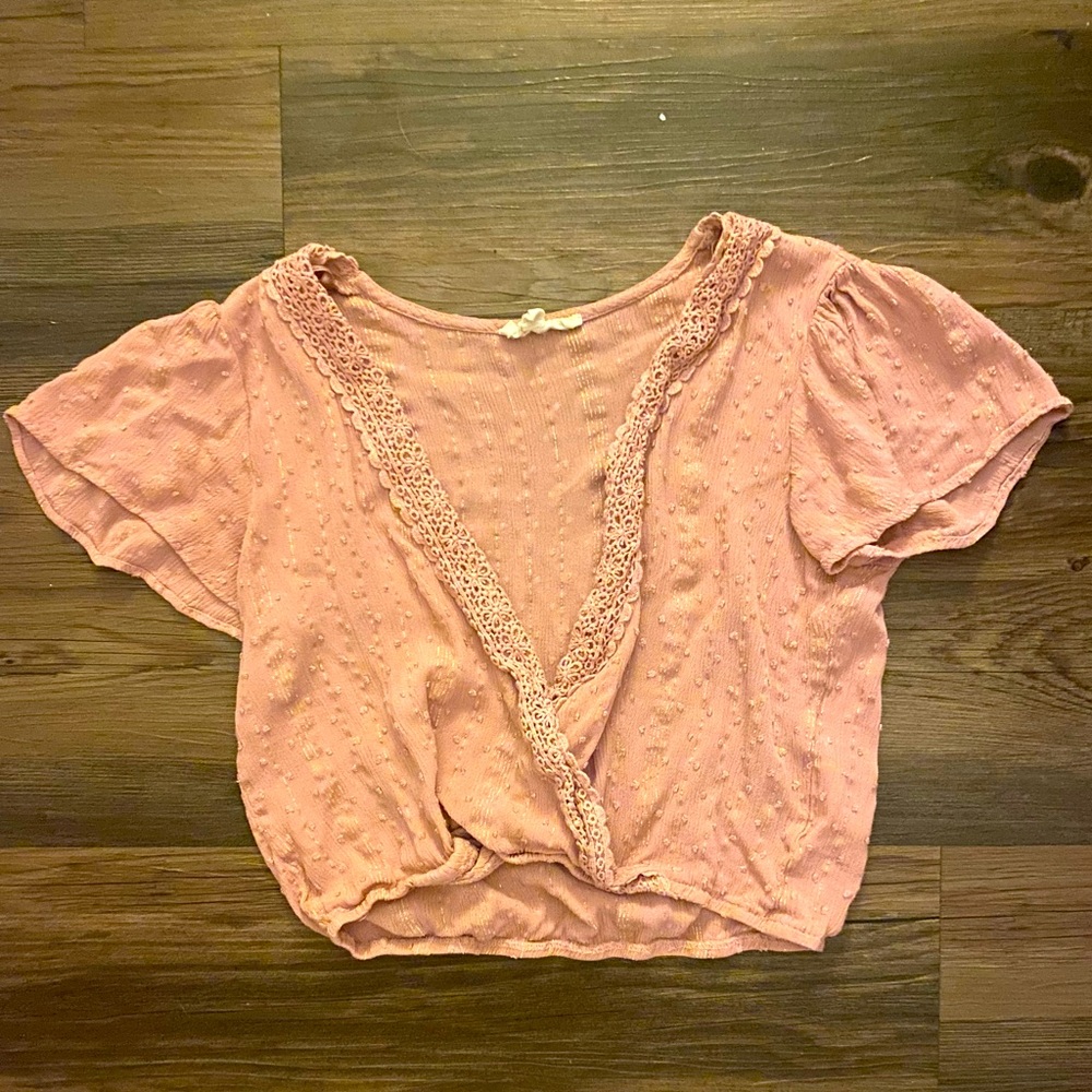 Cute pale pink shirt with low cleavage line